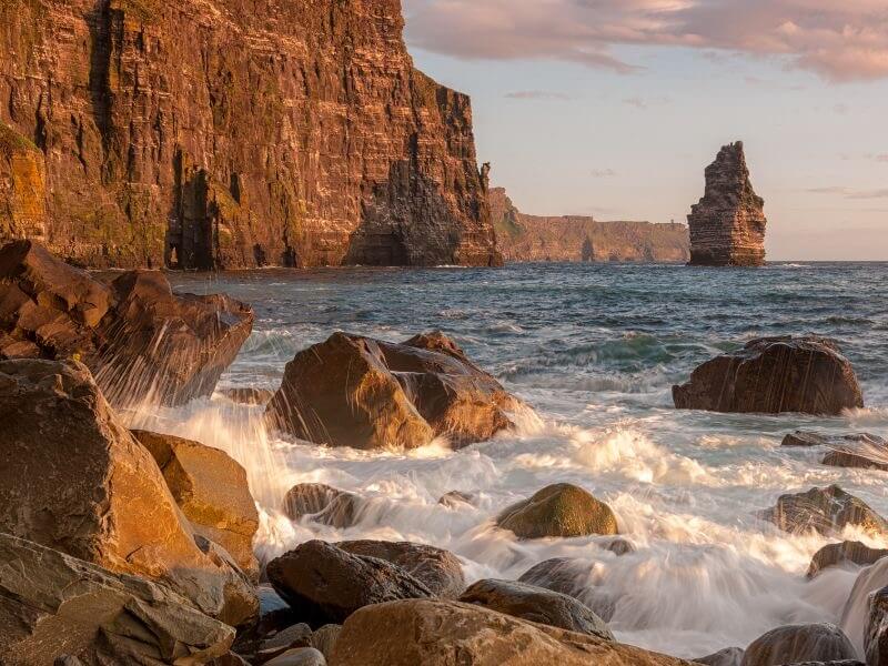 Layers of rock formations creating a natural stairway down the Cliffs of Moher to the Ocean Below.