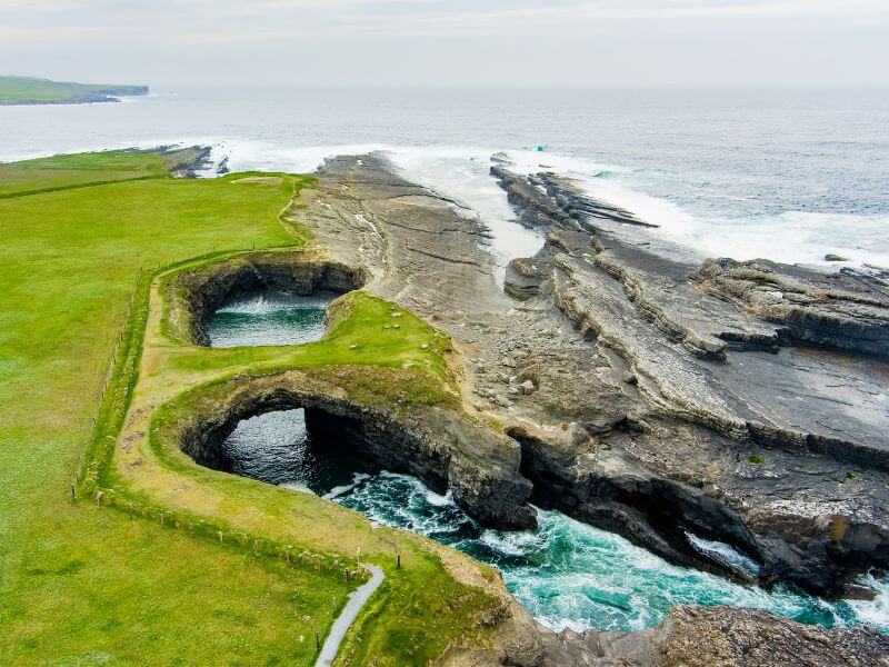 Rugged coastal landscape at Bridges of Ross in County Clare, Ireland. Rugged coastal landscape at Bridges of Ross in County Clare, Ireland.