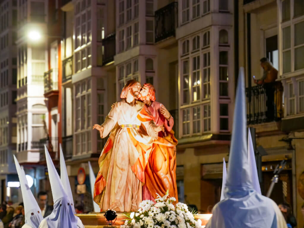 Basque Country's Semana Santa: Colourful procession featuring intricately decorated floats and solemn participants.