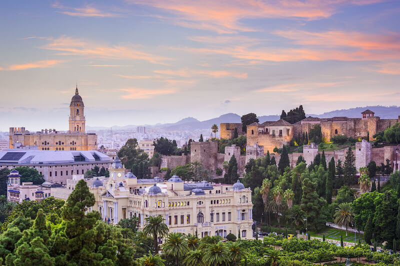 Historic buildings of Malaga at sunset.