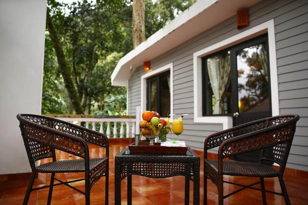 Private villa with a garden at a luxury resort in Munnar.