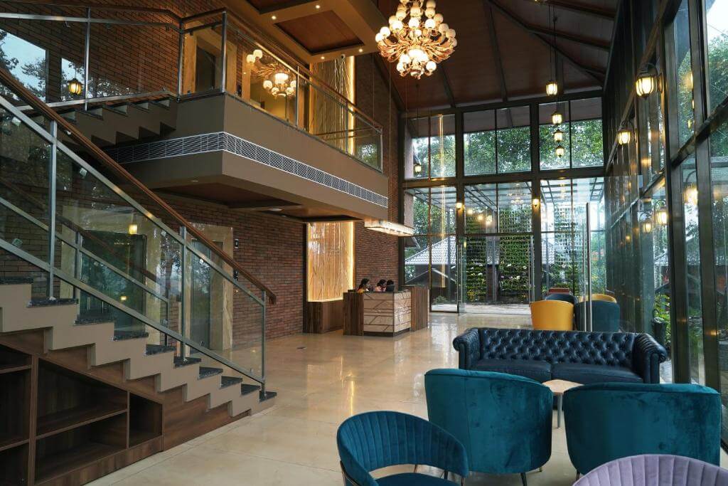 Luxurious lobby with modern amenities at a Munnar 5-star resort.