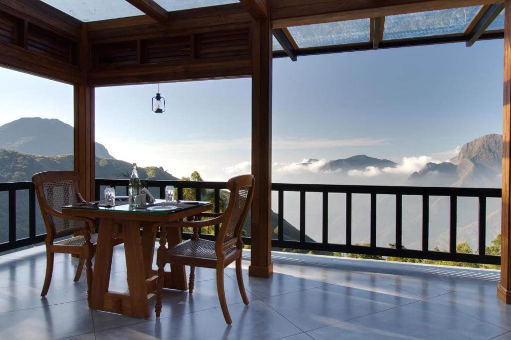 Serene view from a private balcony dinner at a luxury hotel in Munnar.