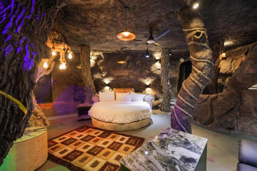 Unusual cave bedroom featuring a Queen-sized bed in a private villa at Parakkat Nature Resort.