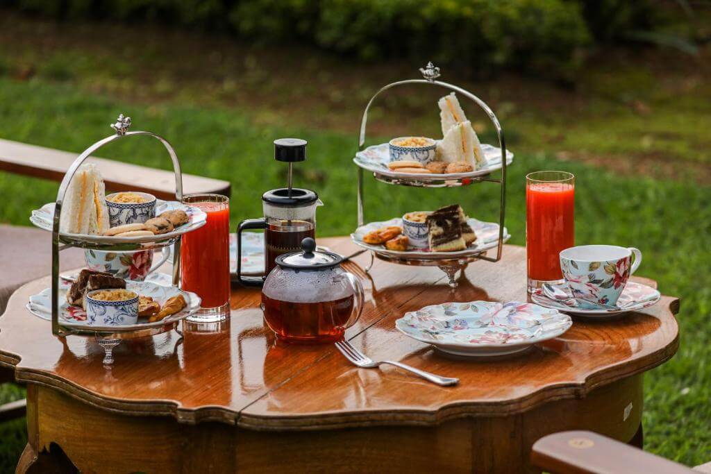 A table set up with afternoon tea at Lockhart bungalow in Munnar.
