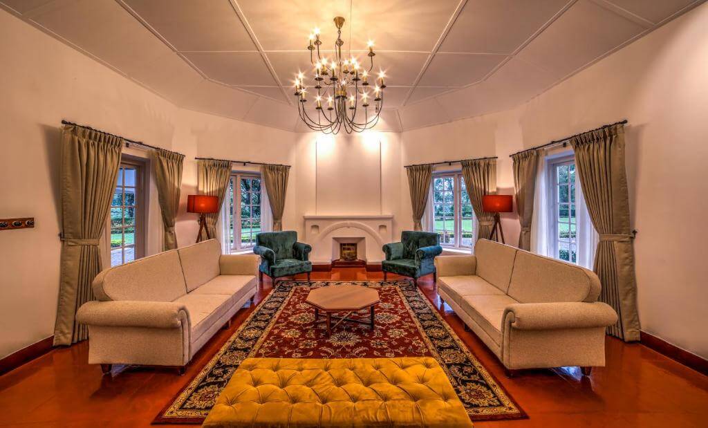Elegant lounge area with scenic views at a Munnar 5-star villa.