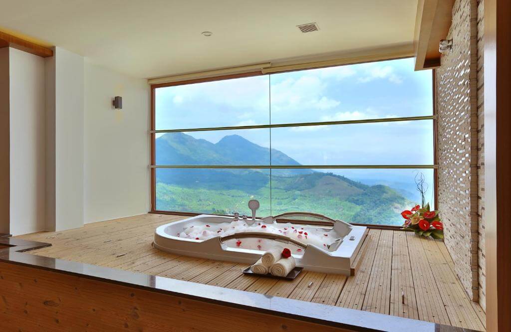 Scenic view from a private jacuzzi at a Munnar 5-star hotel.