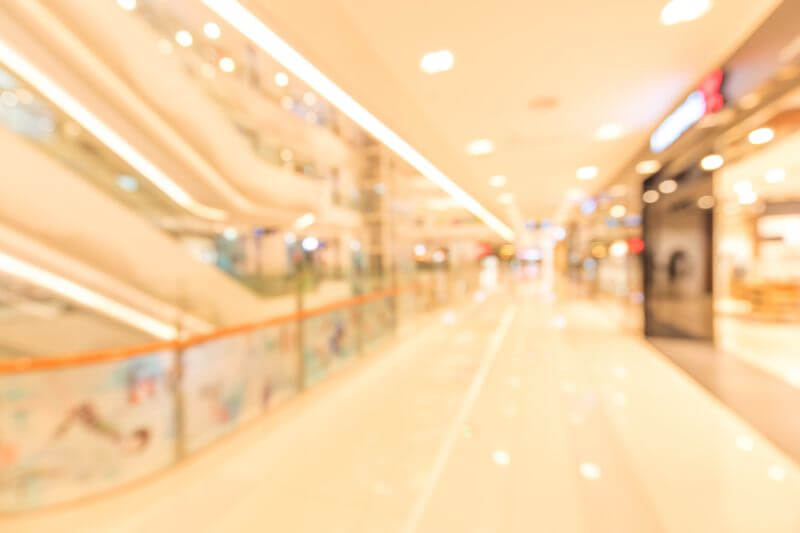 Shoppers exploring the various fashion stores inside MyZeil mall in Frankfurt.