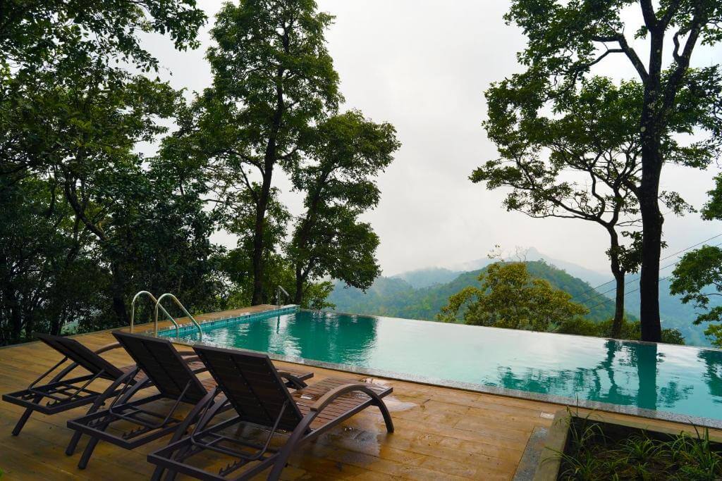 Infinity pool with mountain views at a 5-star resort in Munnar.