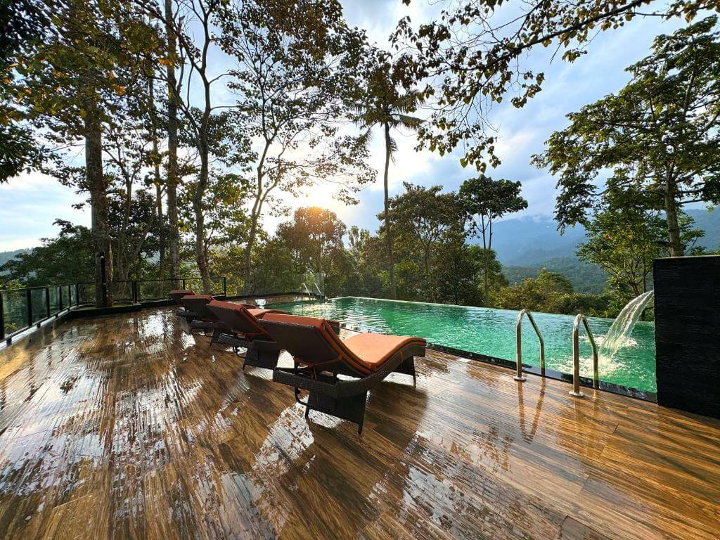 Outdoor pool with panoramic views at a 5-star hotel in Munnar.