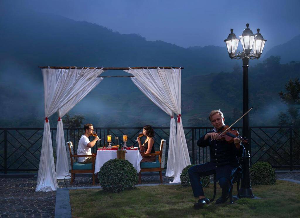 Romantic candlelit dinner setup at a luxury hotel in Munnar.