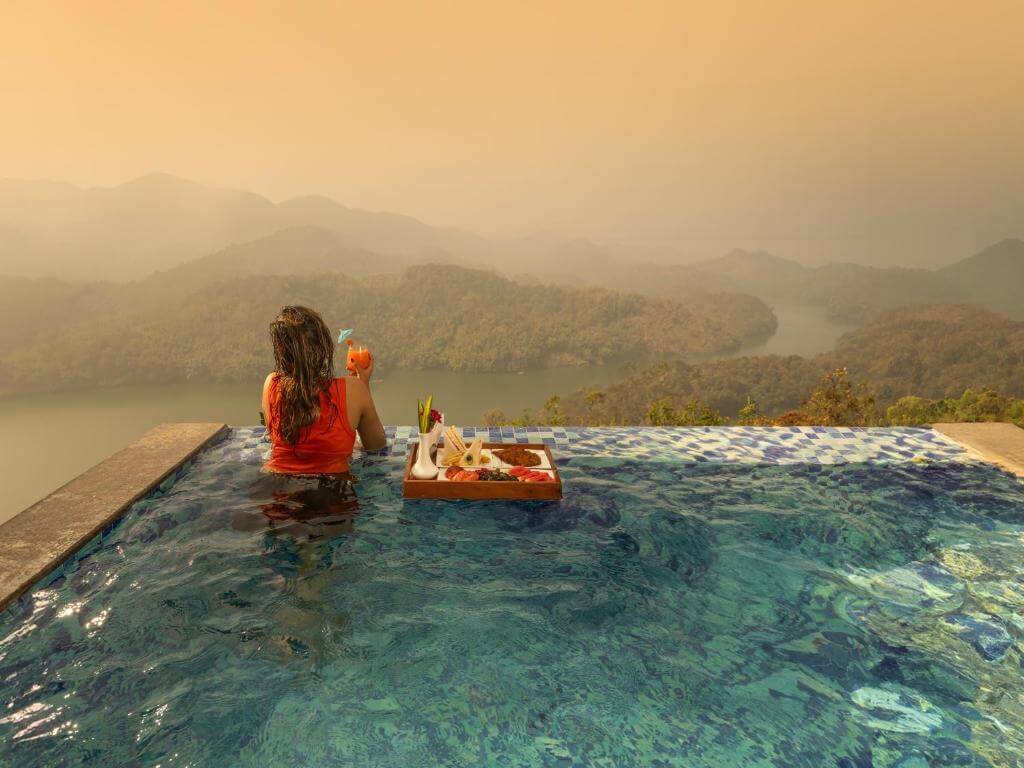Infinity pool with mountain views at a 5-star resort in Munnar.