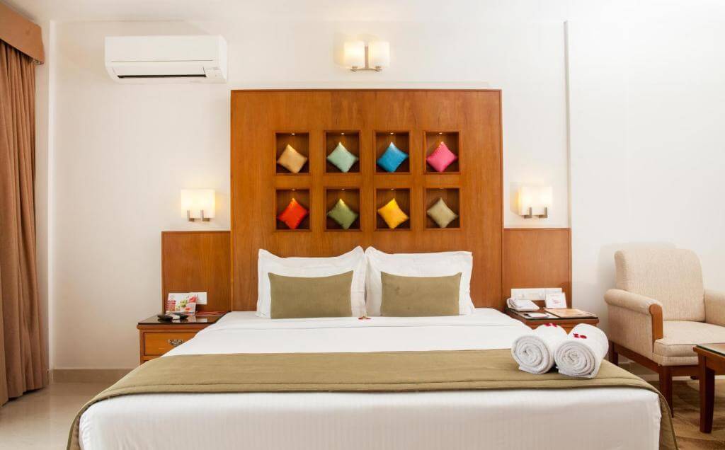 Luxurious bedroom at a 5-star hotel suite in Munnar.