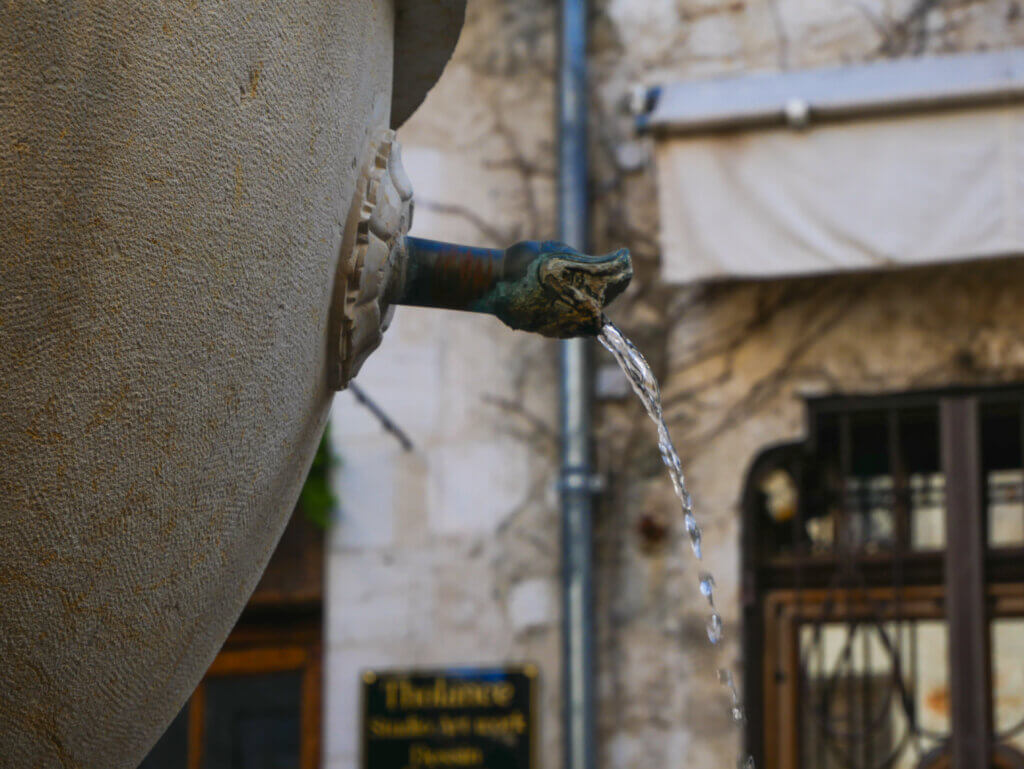 Close up of the water spout of the fountain in the main square of Saint Paul de Vence.