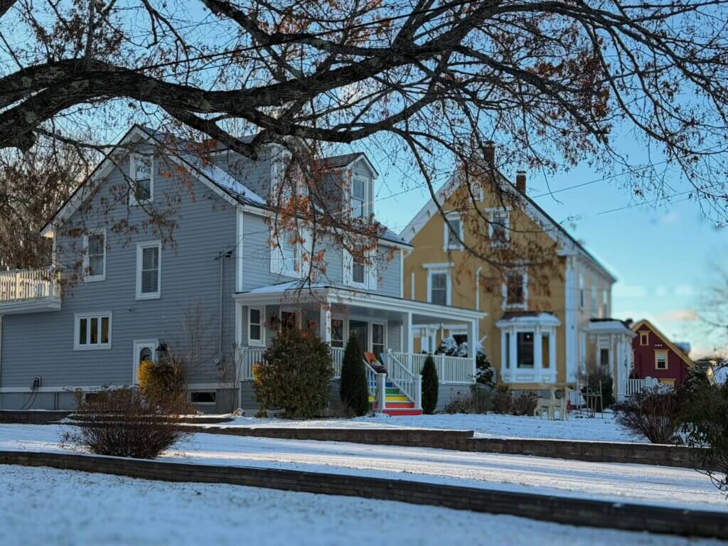 Charming houses decorated for Christmas in Mahone Bay one of the best places to visit in Nova Scotia at Christmas.