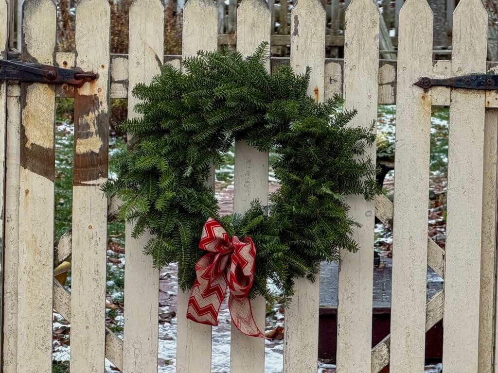 Christmas wreath on a rustic gate in Shelburne, Nova Scotia