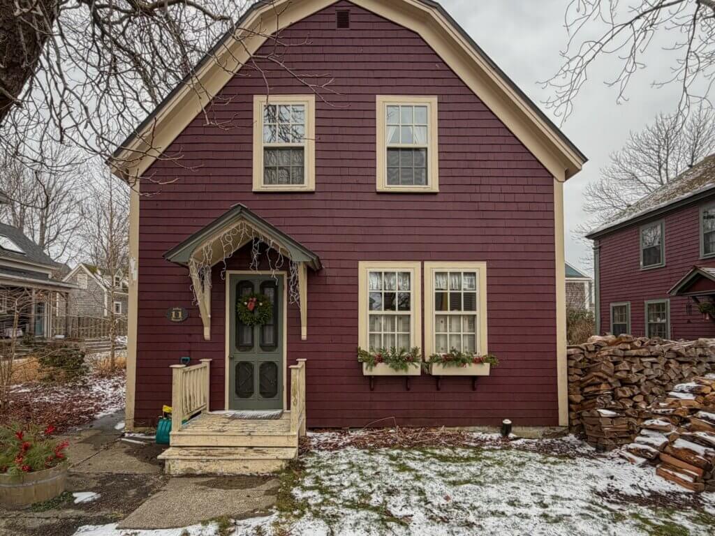 Cute wooden house with a Christmas wreath in Shelburne Nova Scotia